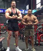 Standing Next to a Giant: Tallest Bodybuilder in the World Stuns Fitness Worldat Indiana Jone